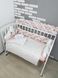 Комплект постільної білизни в дитяче ліжечко, персиковий з хмаринками.
